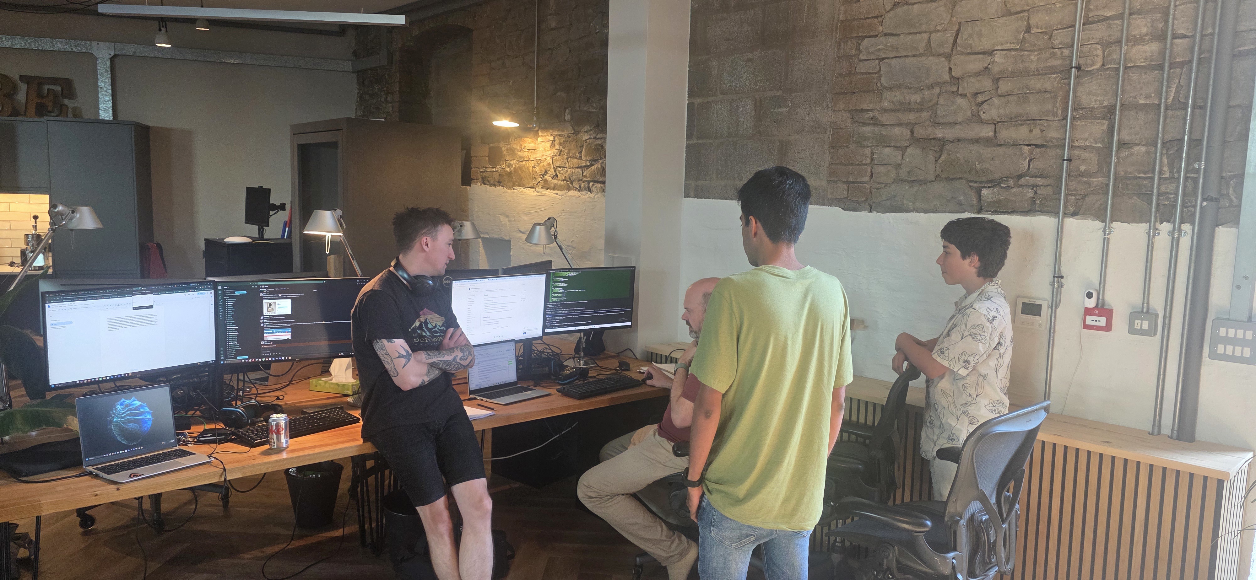 The team including Eli look at the end result and debugging a few issues