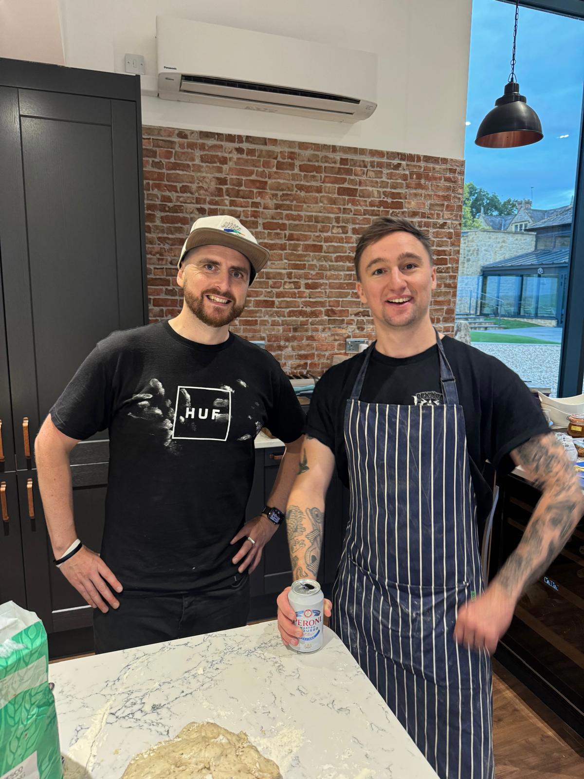 Hooky (left) and Jack (right - wearing an apron) standing triumphantly after some successful pizza-making